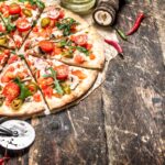 smallfresh-pizza-with-tomatoes-and-greens-2023-11-27-05-03-27-utc